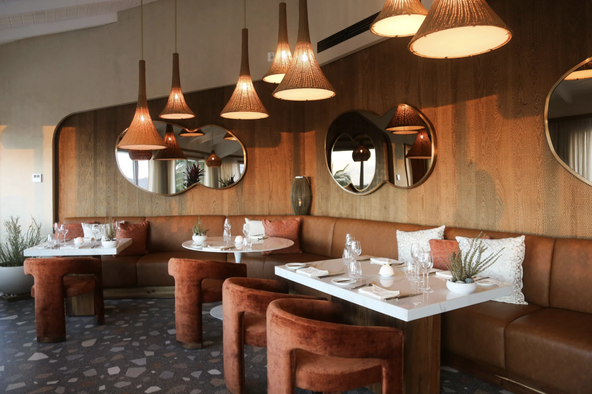 a restaurant with a booth and tables