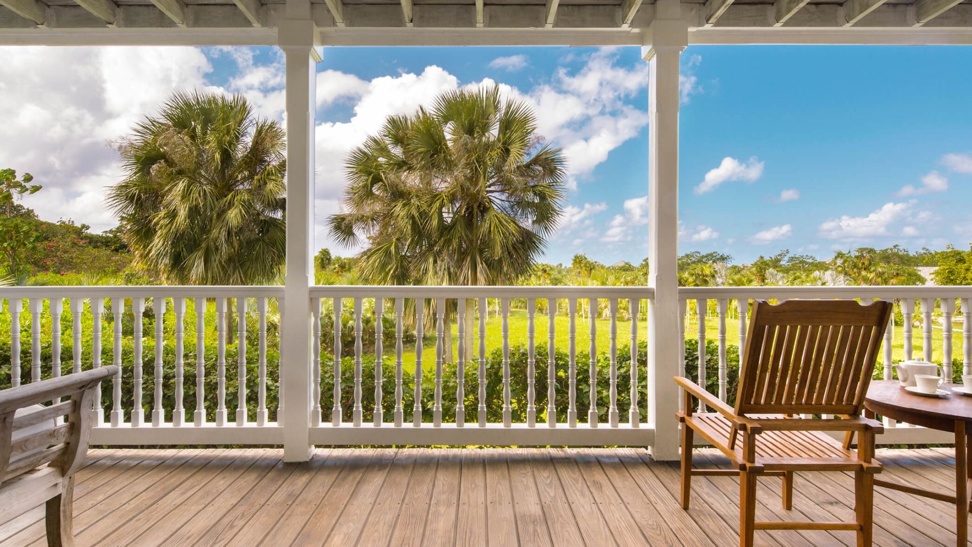 a wooden chair on a porch