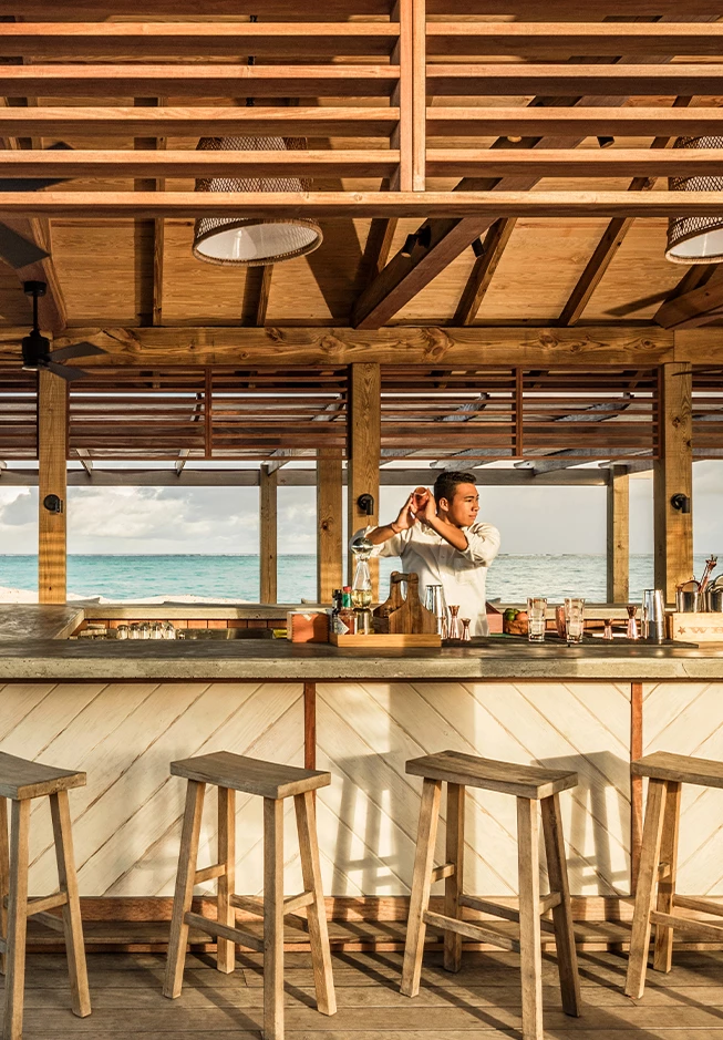 a man standing at a bar