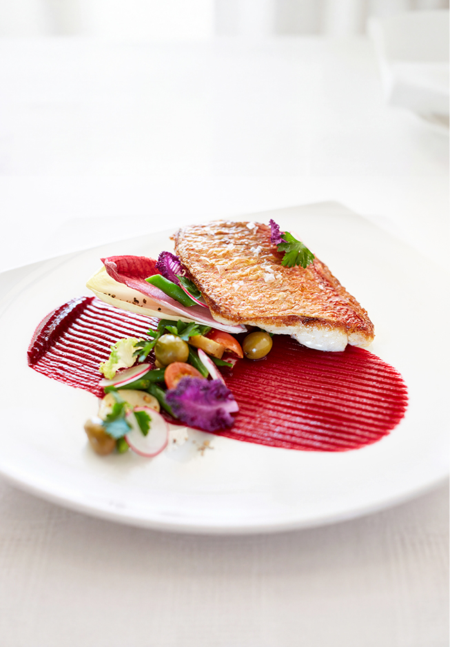 a plate of food on a white surface