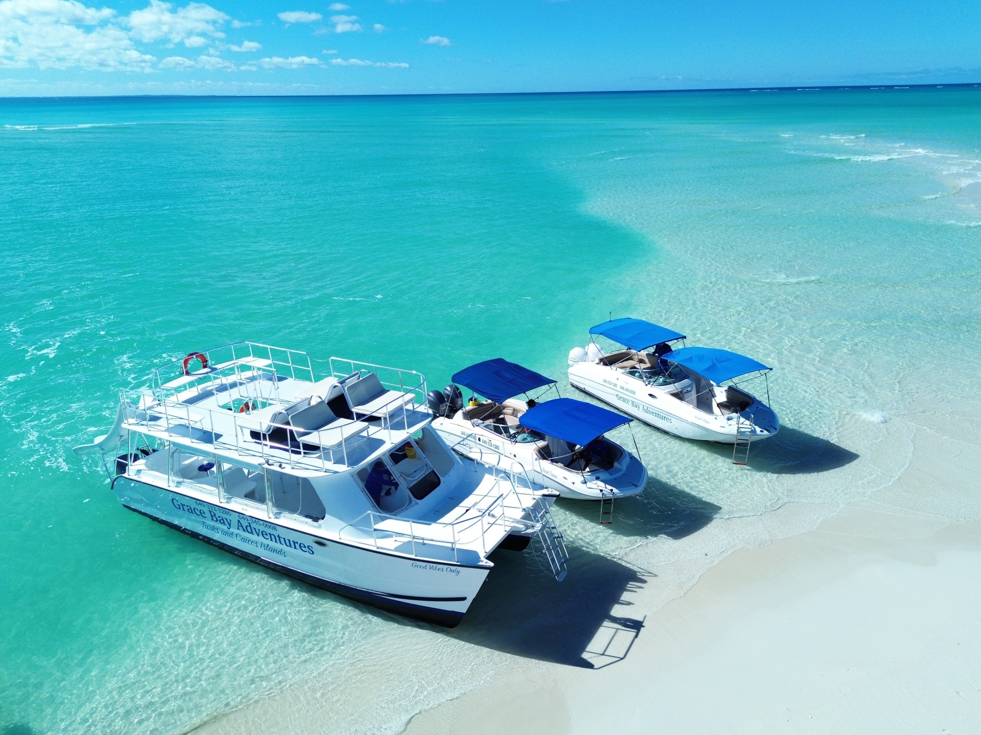 a group of boats on a beach