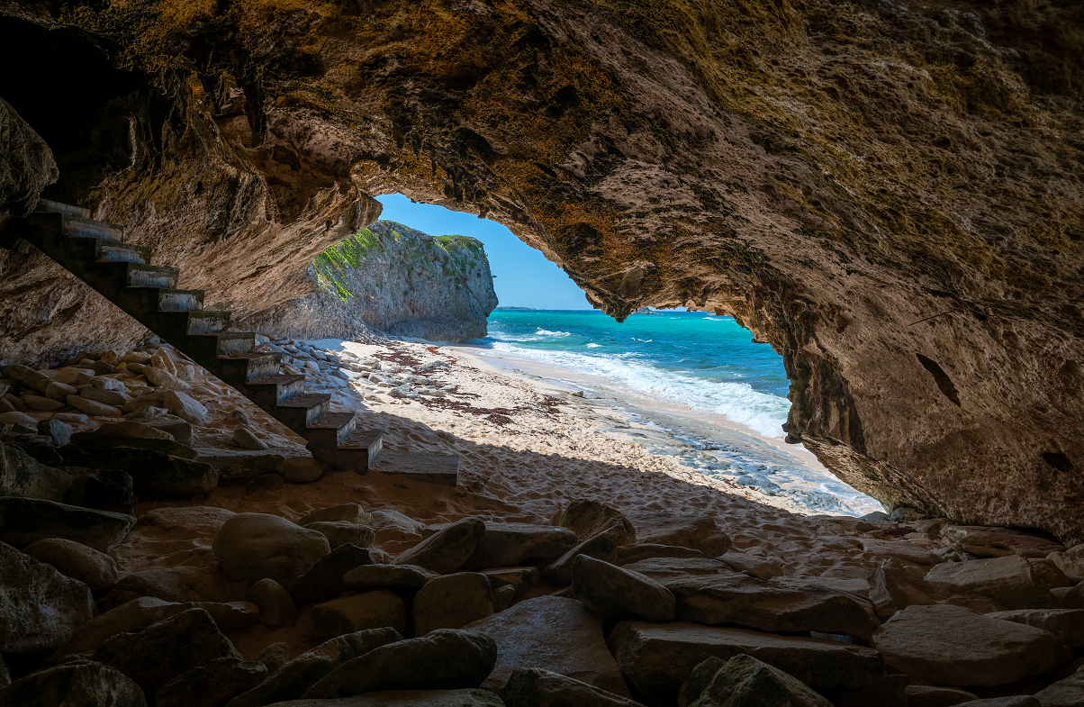 a stairs in a cave on a beach