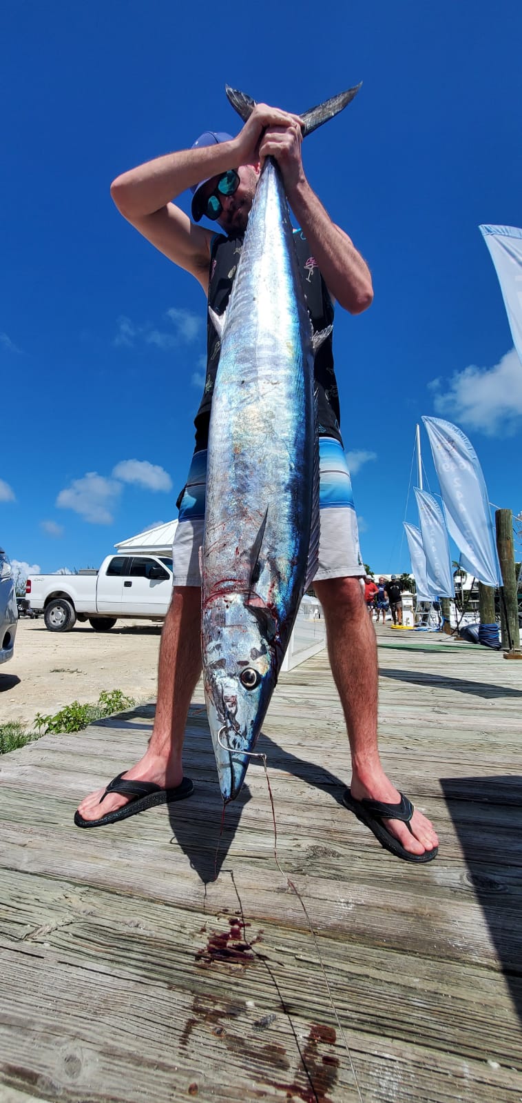 a man holding a fish