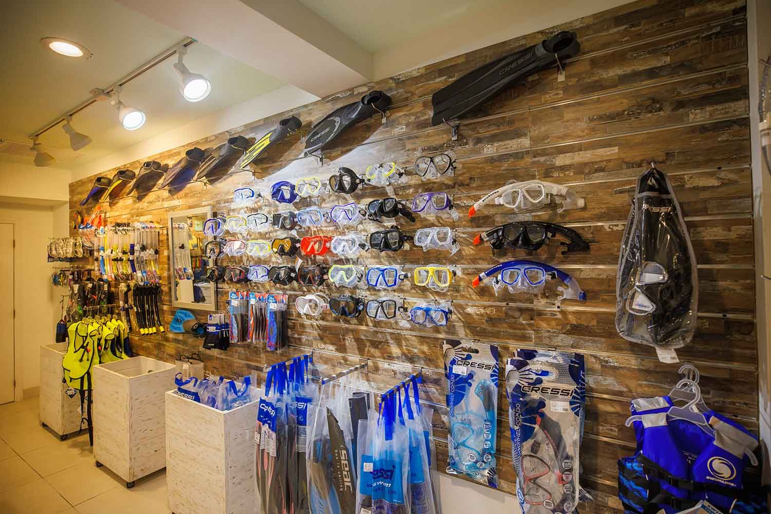 a wall with various diving gear and goggles
