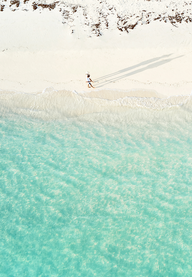 a person walking on a beach