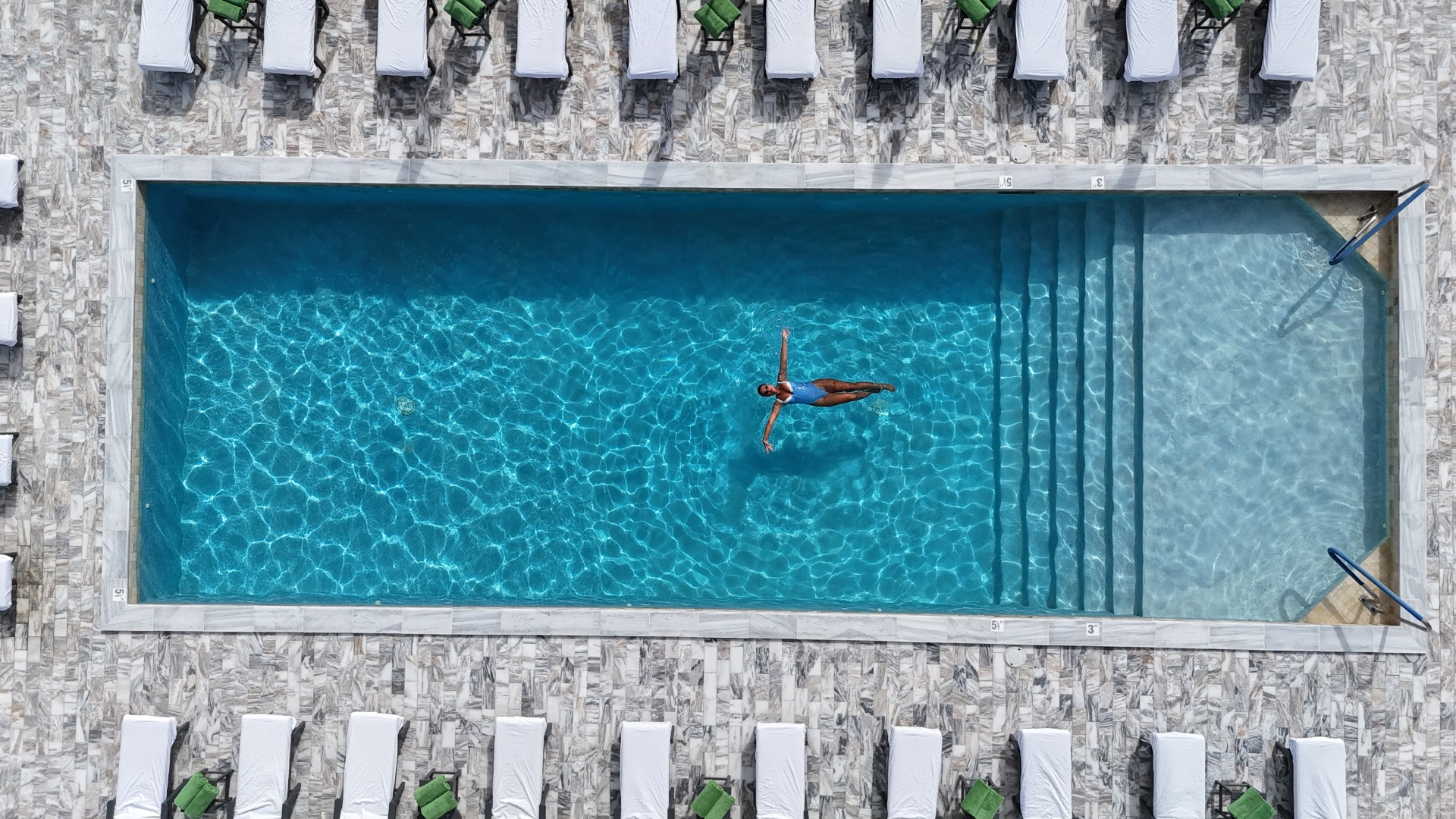 a woman floating in a pool