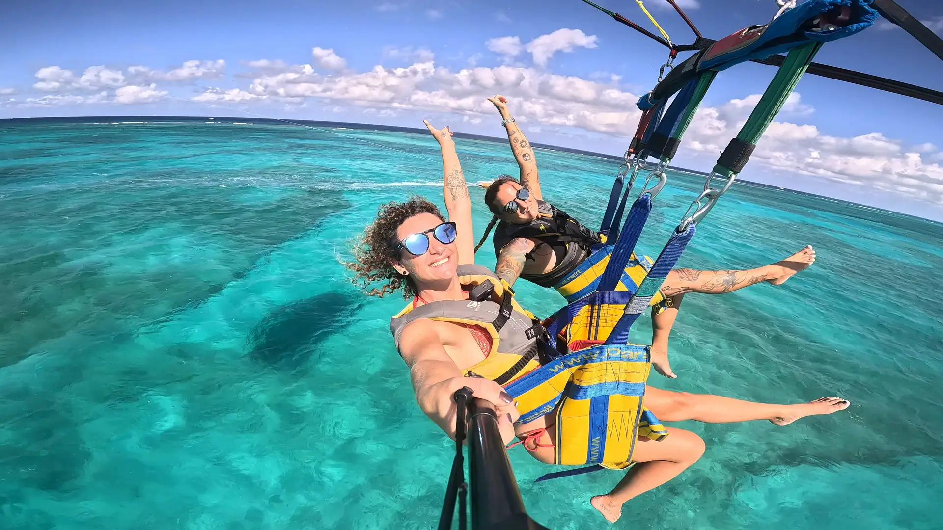 a man and woman in harnesses in the water