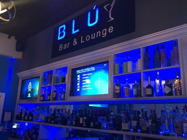 a bar with many bottles of alcohol