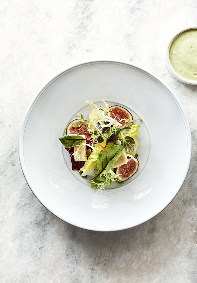 a salad in a white bowl