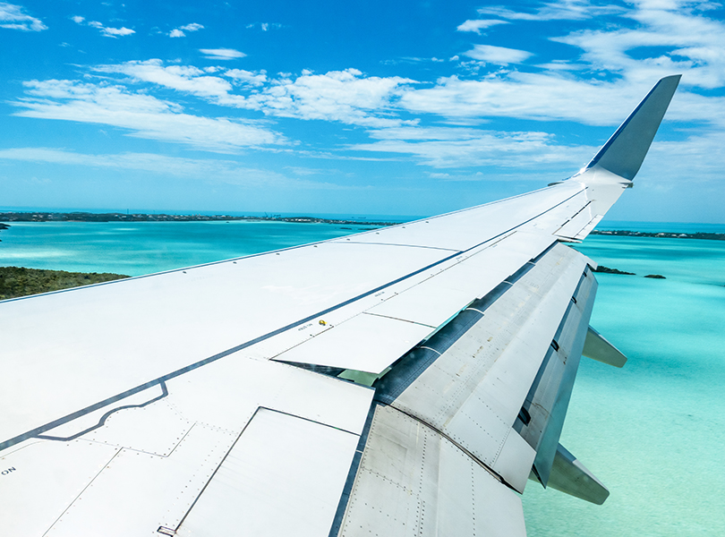 an airplane wing over water