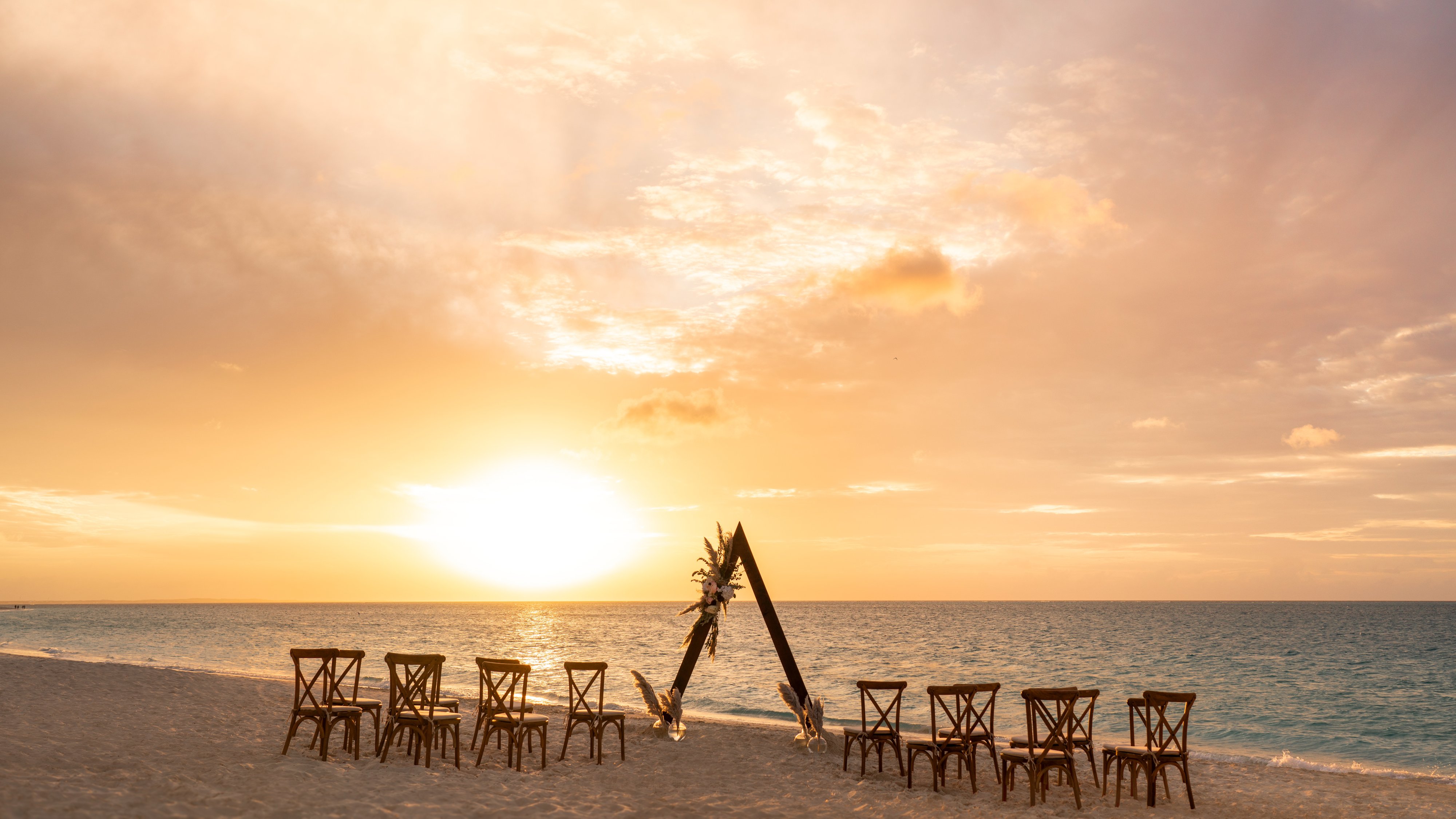 a group of chairs on a beach