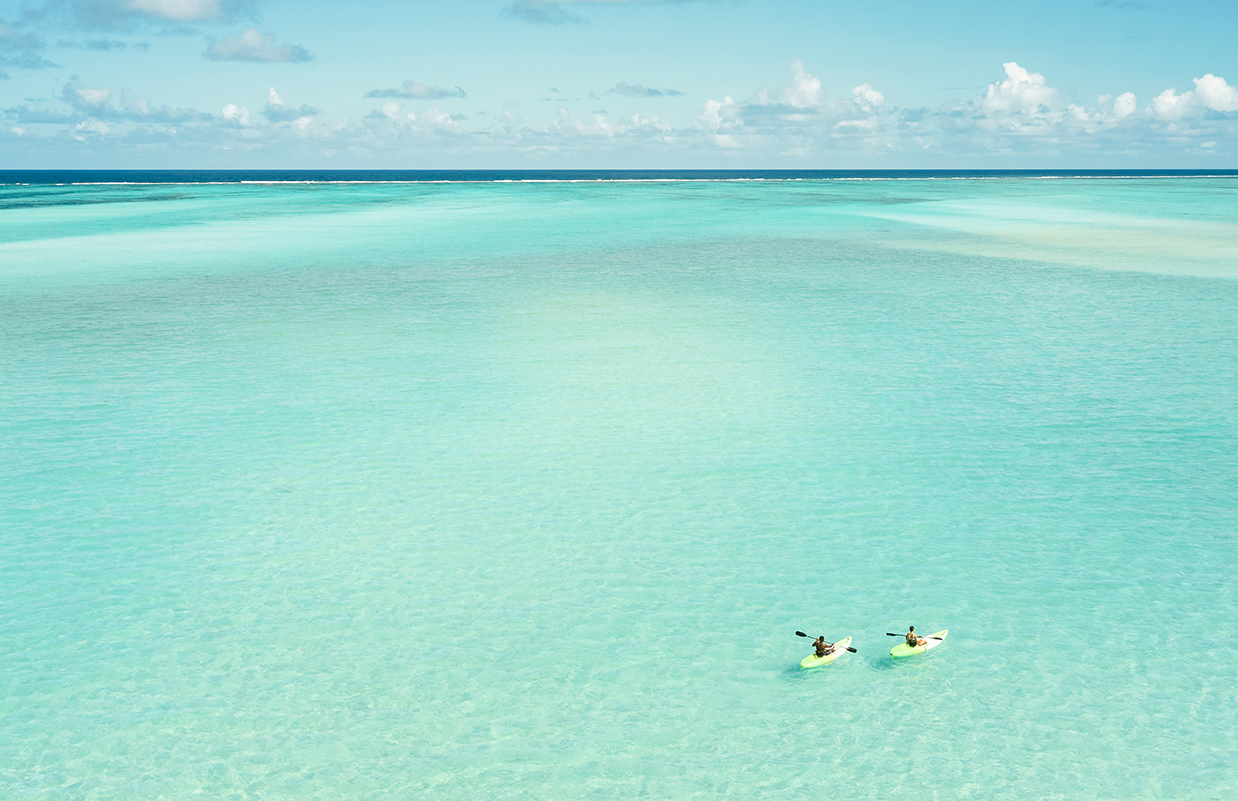 people kayaking in the ocean