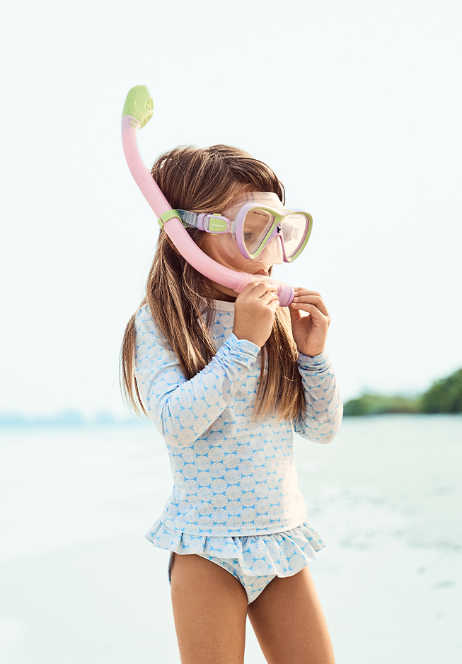 a girl wearing a snorkeling mask