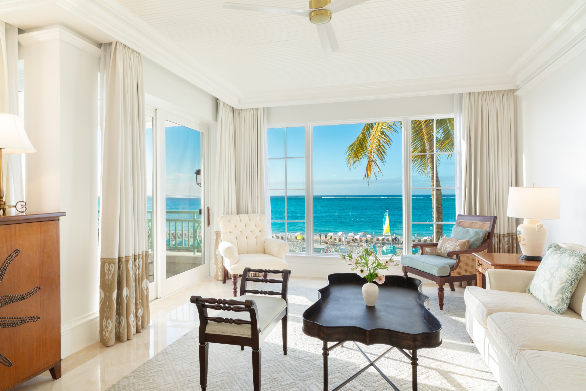 a living room with a view of the ocean