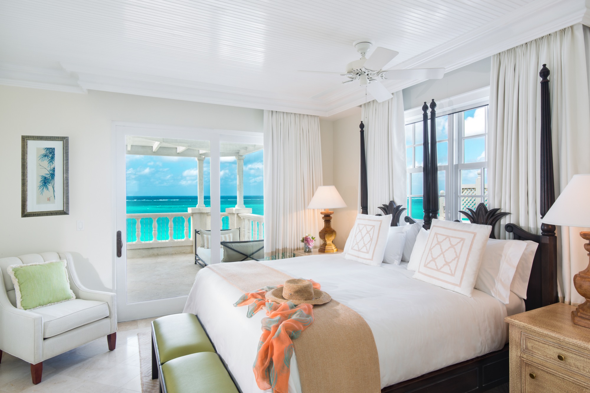 a bedroom with a large bed and a large window