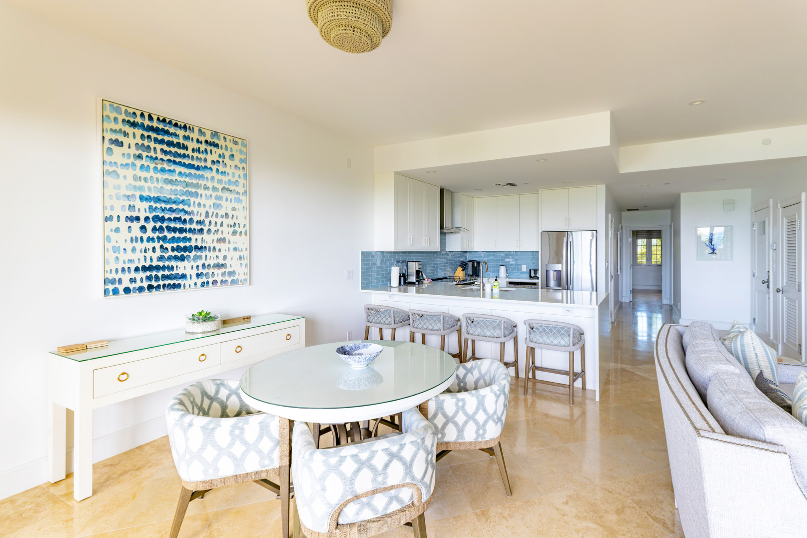 a kitchen and dining room with a table and chairs