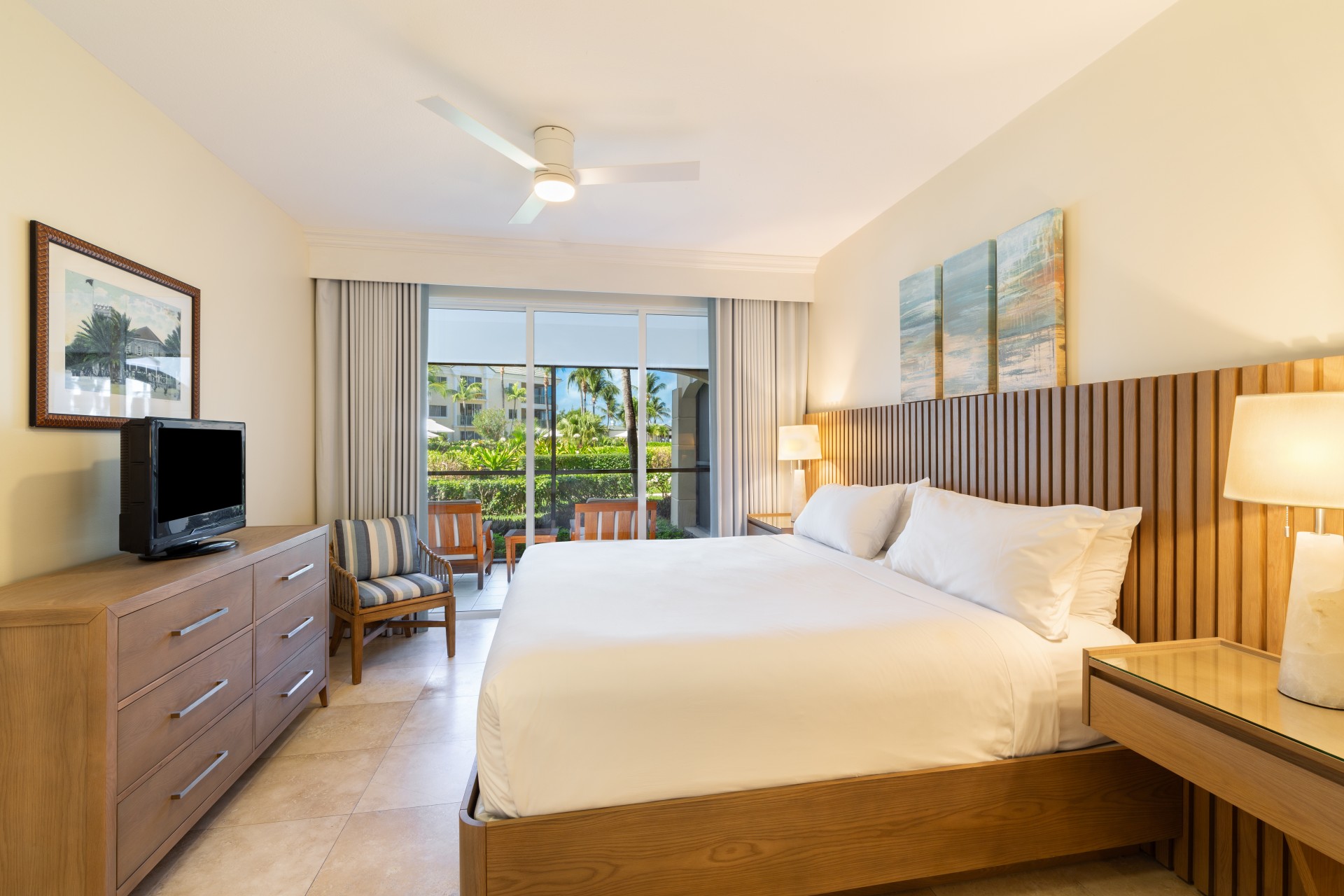 a bedroom with a bed and a television