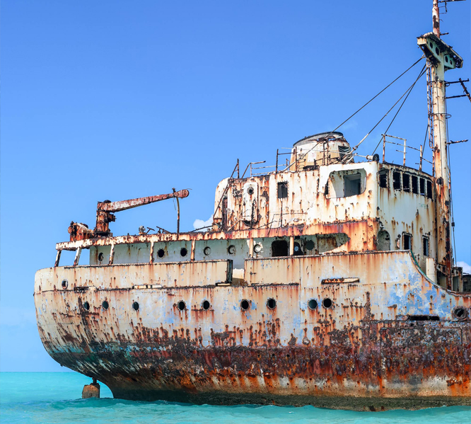 a rusted ship in the water