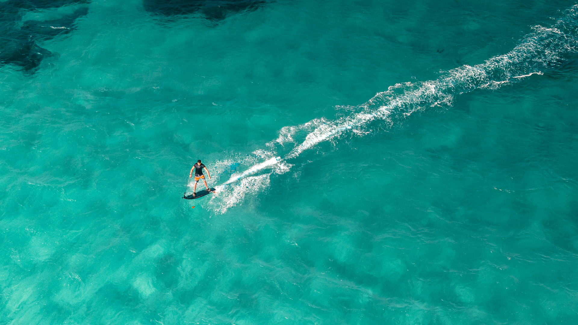 a person on a surfboard in the water