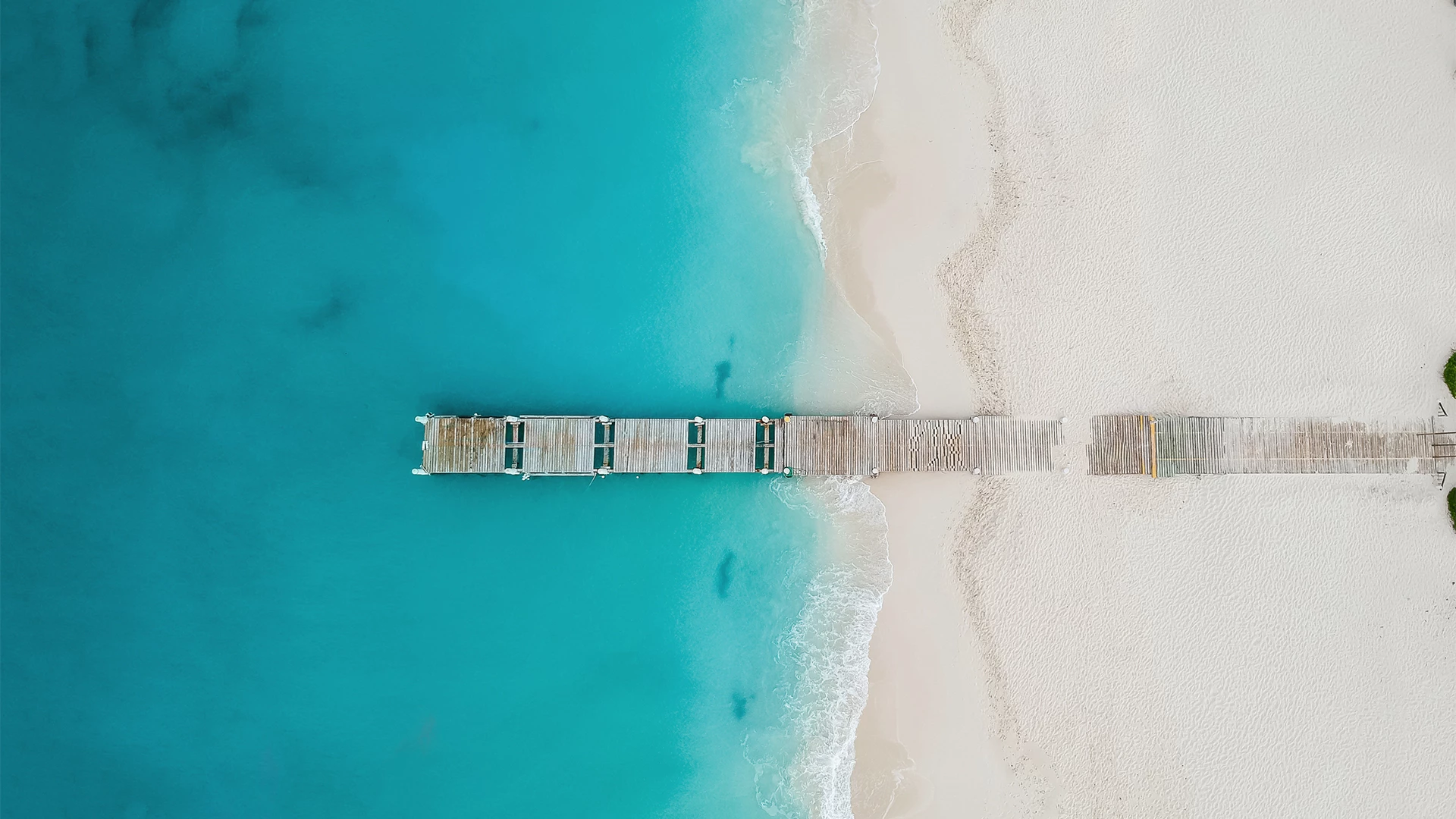 a dock on a beach
