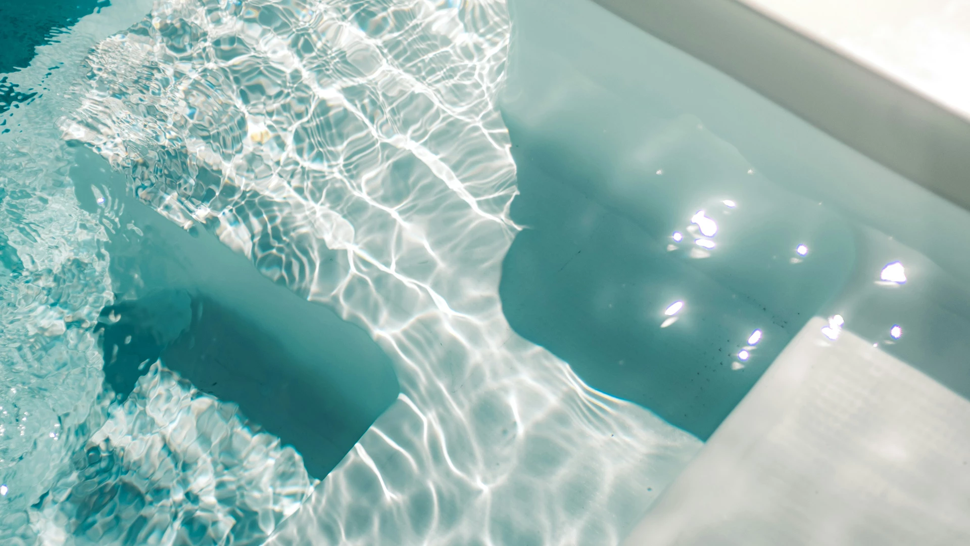 a pool with water and sunlight
