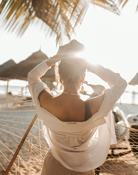 a woman sitting in a hammock