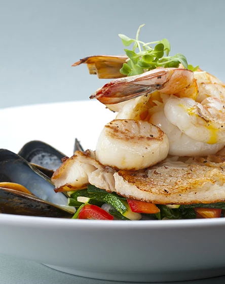 a plate of seafood with a fork