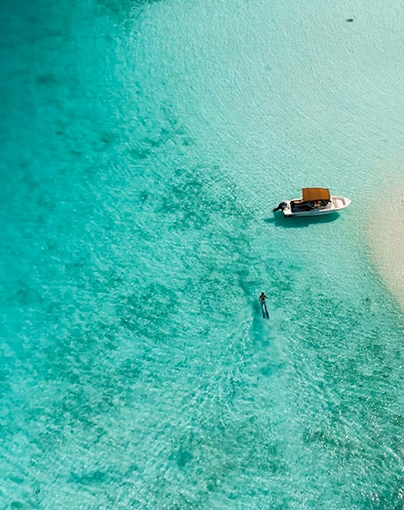 a person swimming in a boat