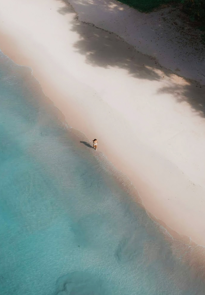 a person walking on a beach