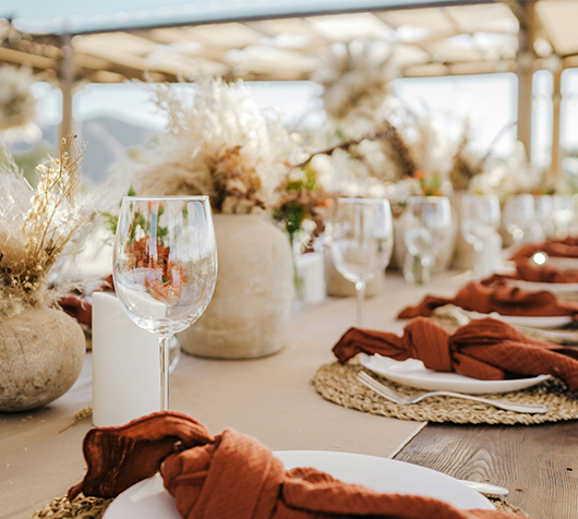 a table set with plates and glasses