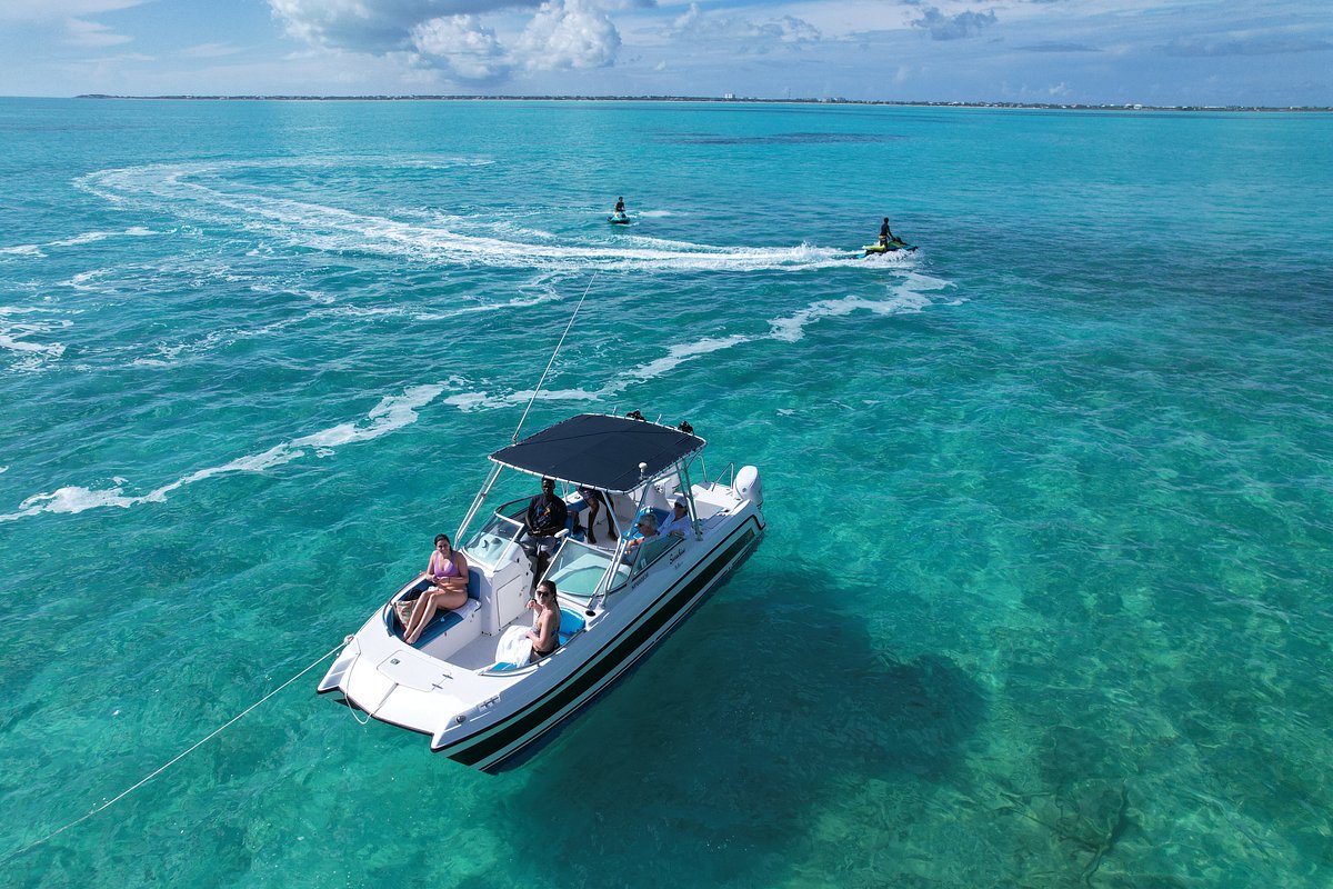 a group of people on a boat in the water