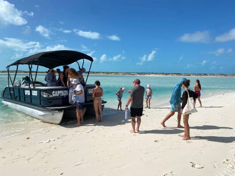 a group of people on a beach