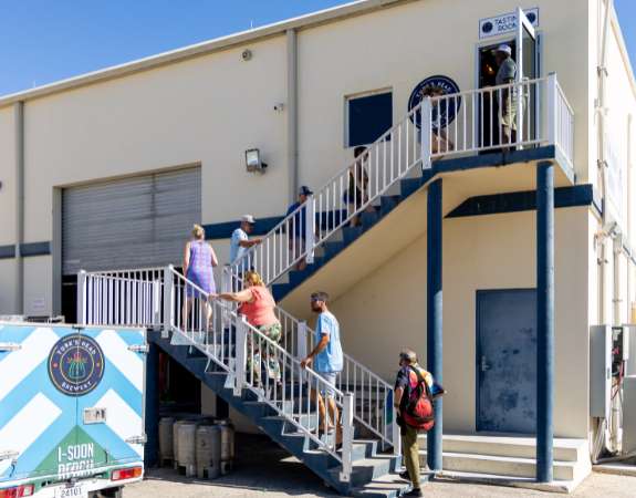 a group of people walking up stairs outside a building