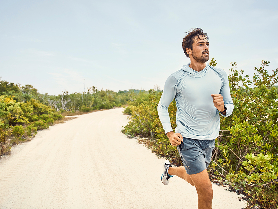 a man running on a dirt road