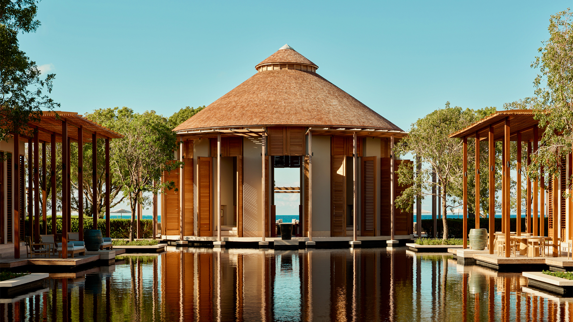 Haw Phra Kaew with a circular roof and a body of water