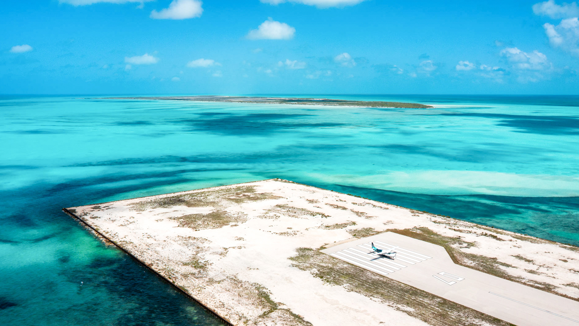 an airplane on a runway at an island