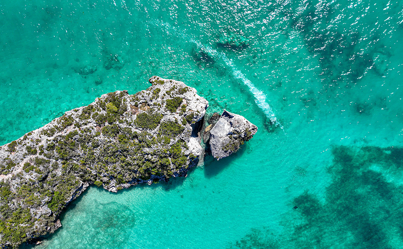 a rock island in the water