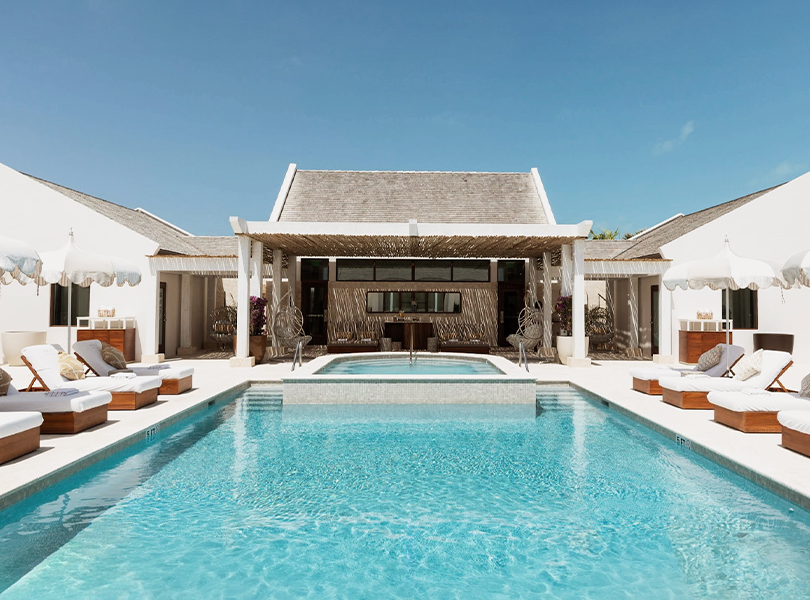 a swimming pool with a large pool in the middle of a house