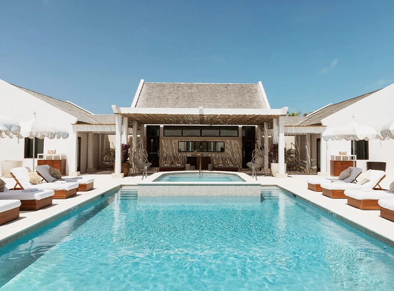 a swimming pool with a large pool in the middle of a house