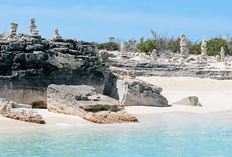 a beach with rocks and water