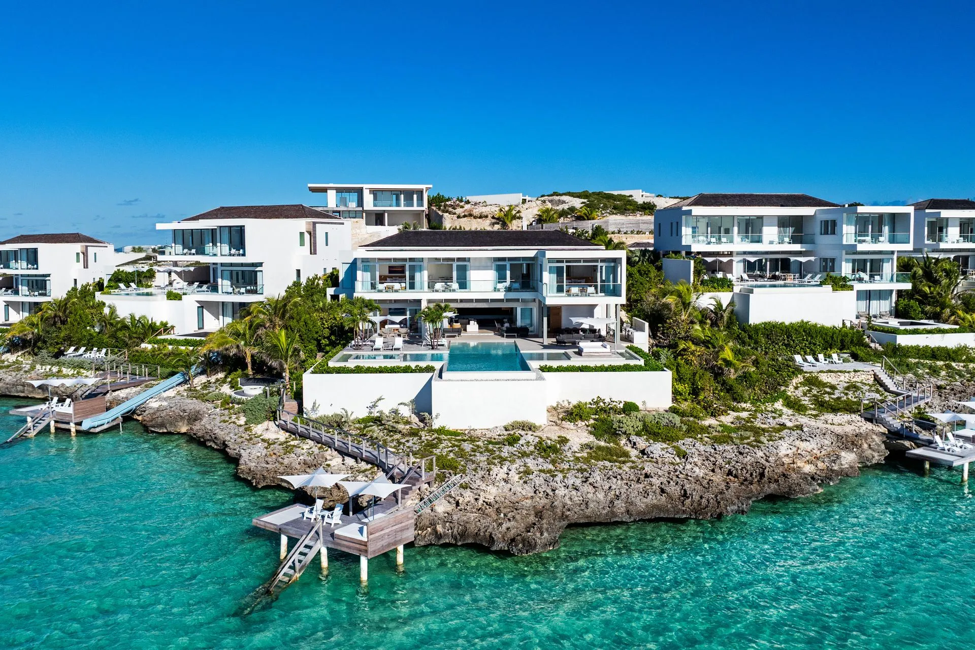 a white building on a rocky island