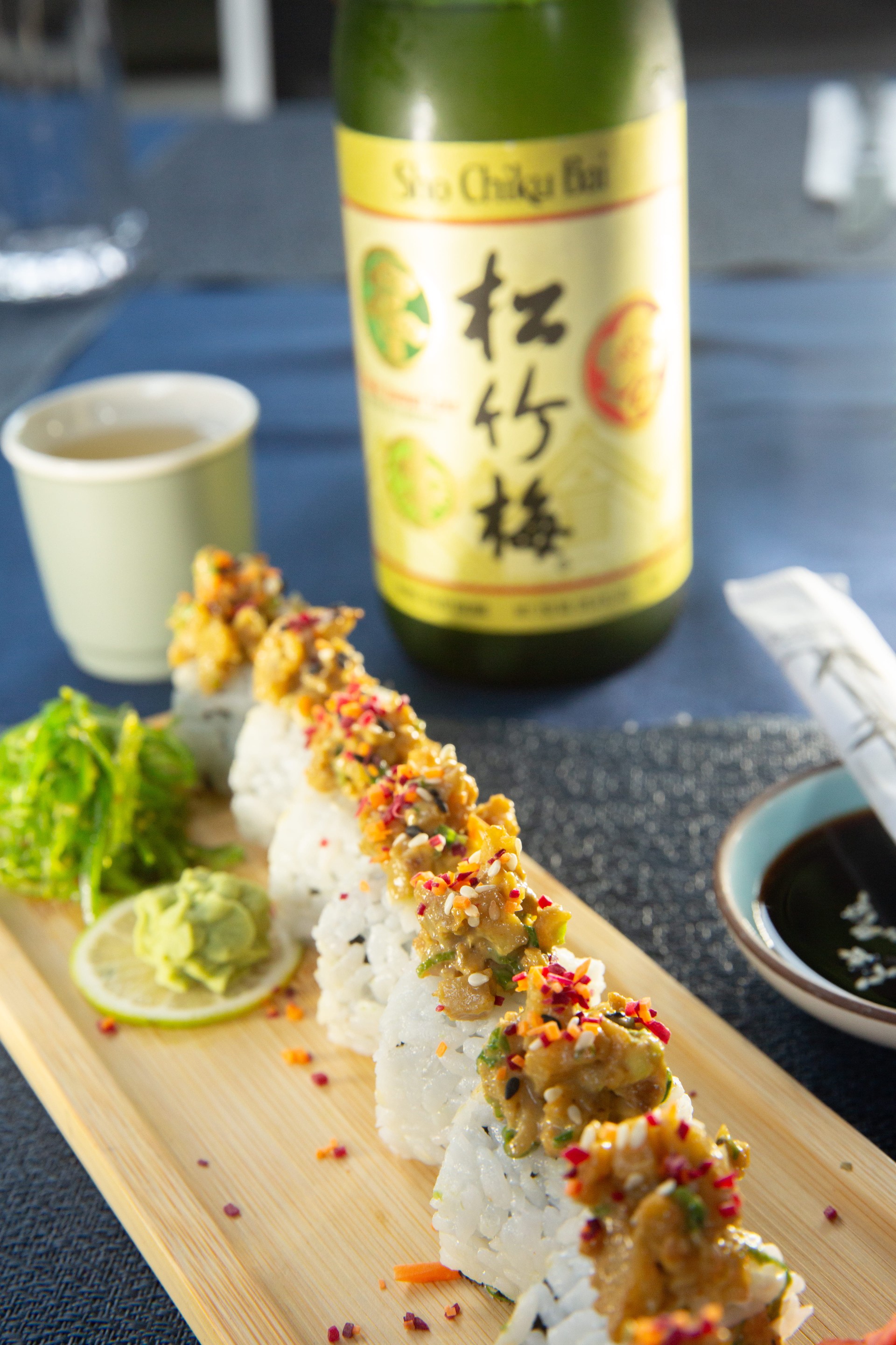 a sushi on a wooden plate