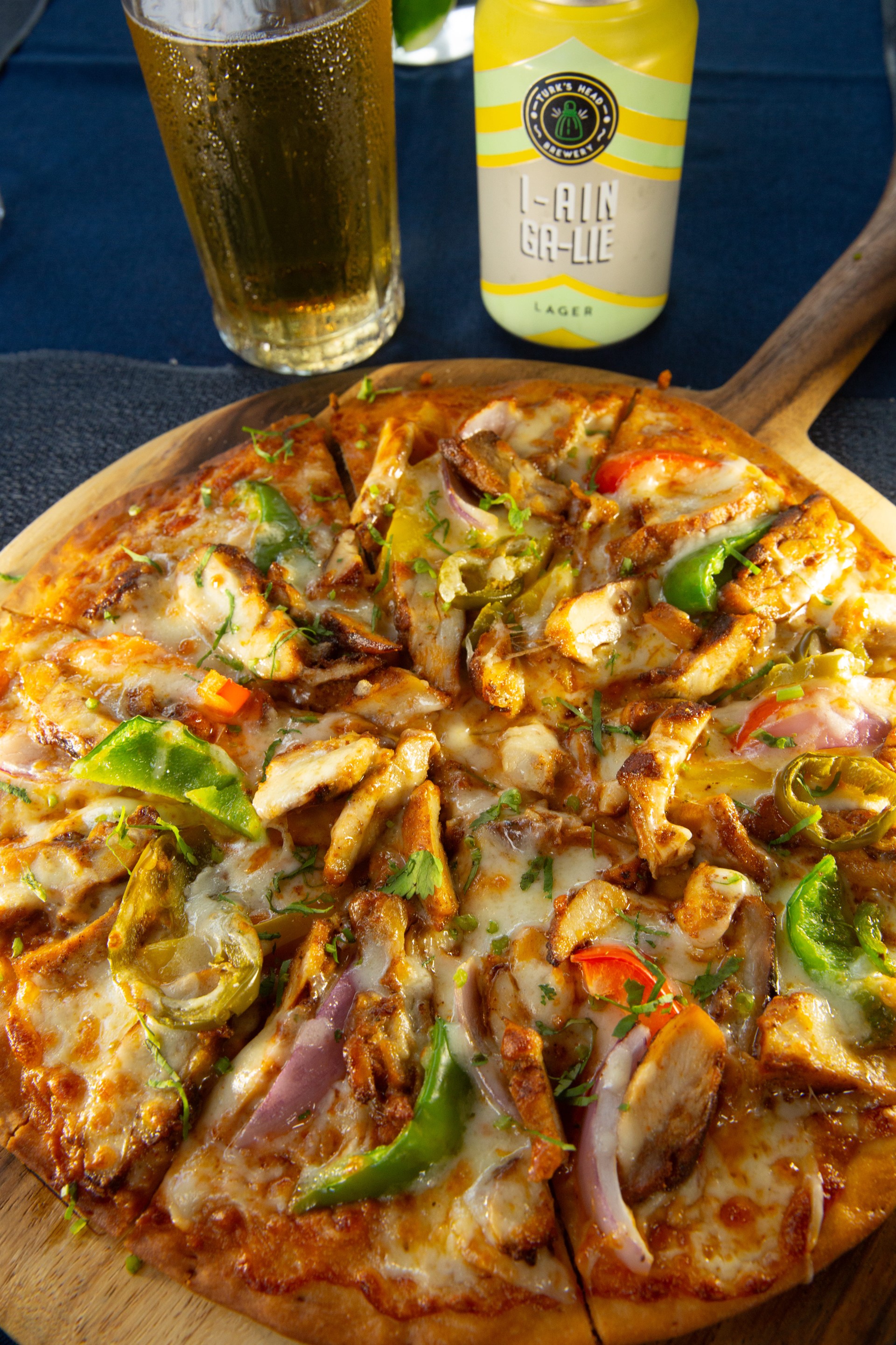 a pizza on a wooden board
