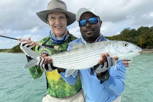 two men holding a fish