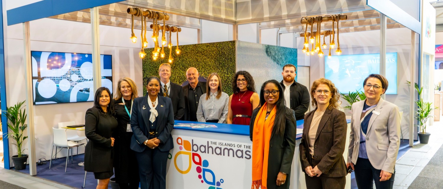 a group of people standing in front of a booth