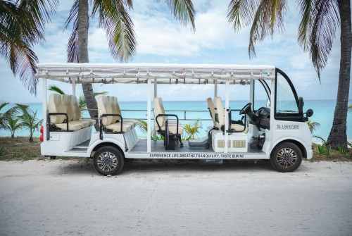 a white vehicle with seats on the side