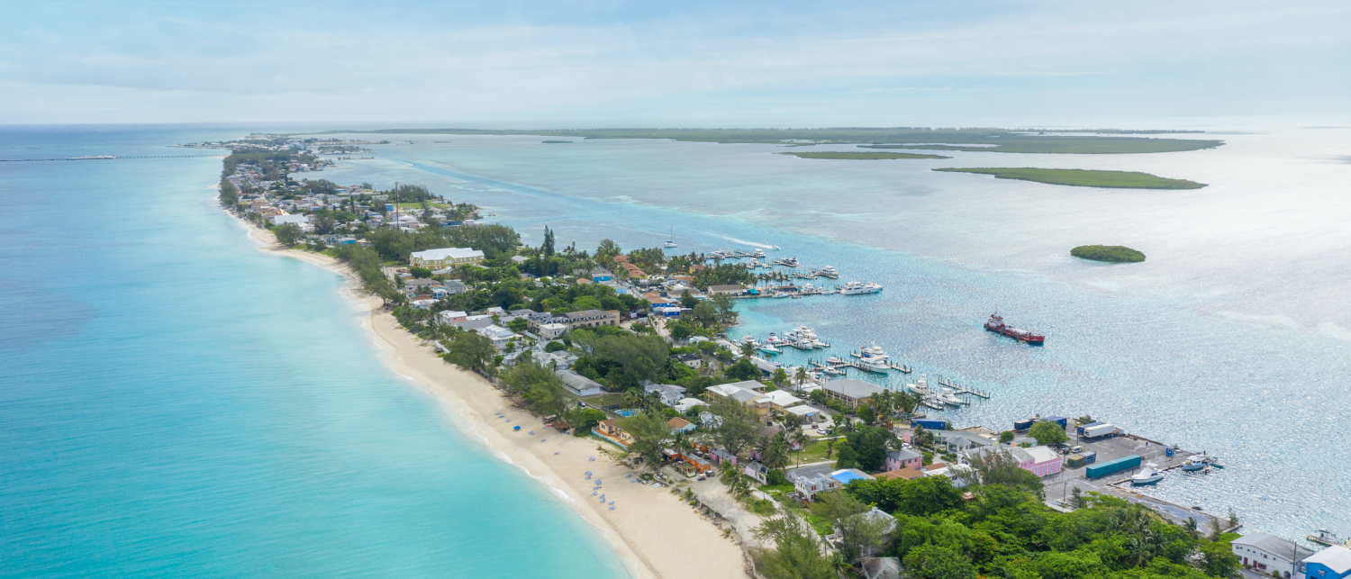 a beach with boats and buildings on it
