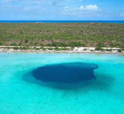a blue water with a large hole in it