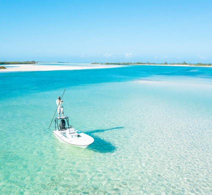 a person standing on a boat in the water