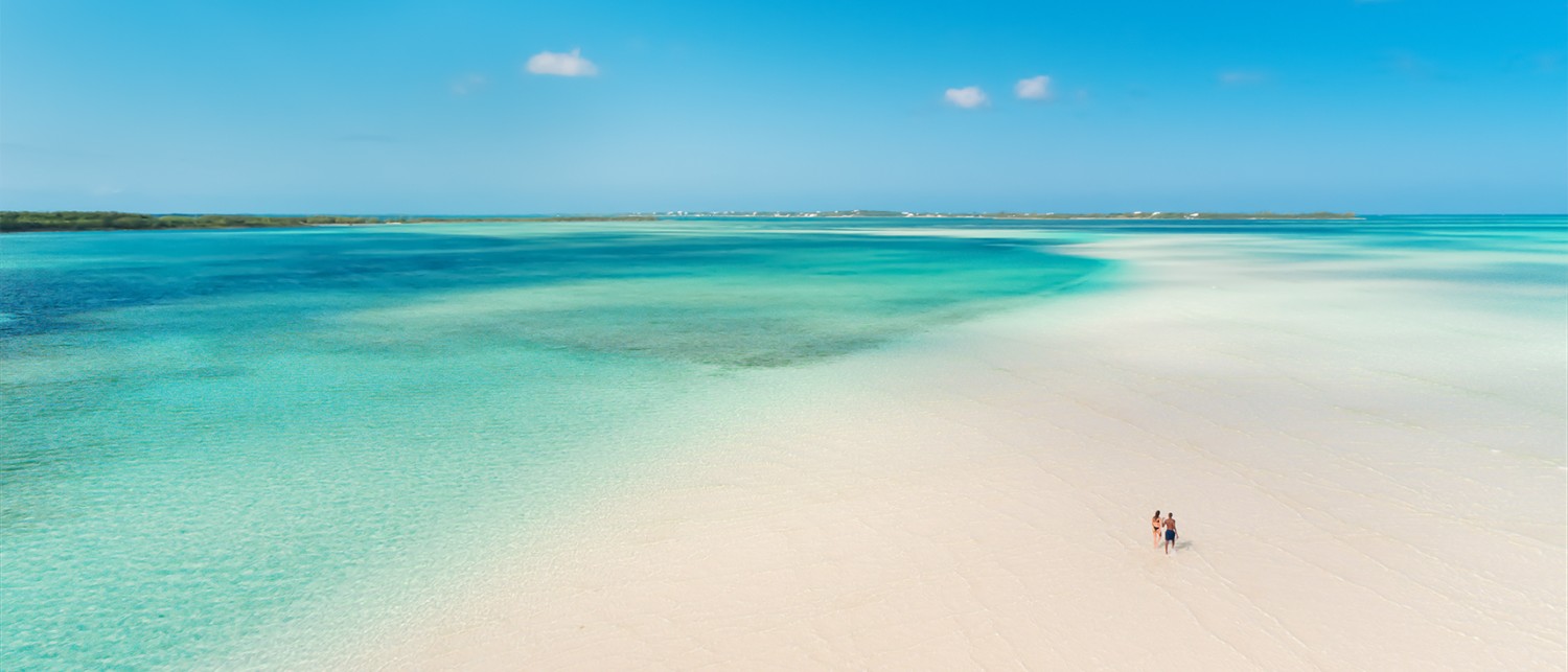 a beach with clear blue water